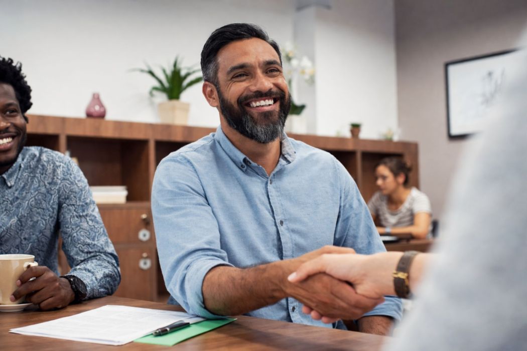 Business clients discussing international payments with a dedicated currency specialist