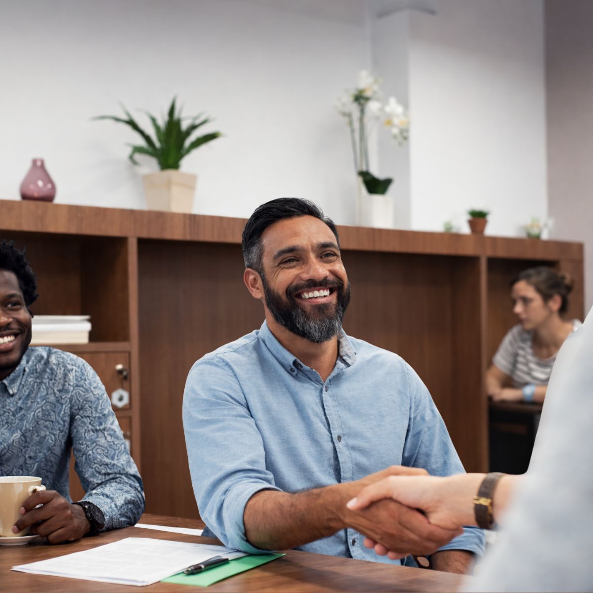 Business clients discussing international payments with a dedicated currency specialist