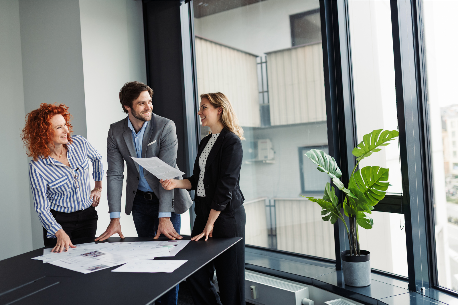 UK business team in modern office reviewing international payment strategy