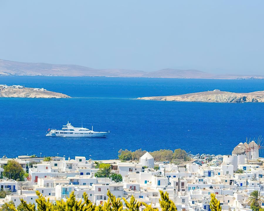 Coastal property with for-sale sign — repatriating overseas property sale proceeds to the UK